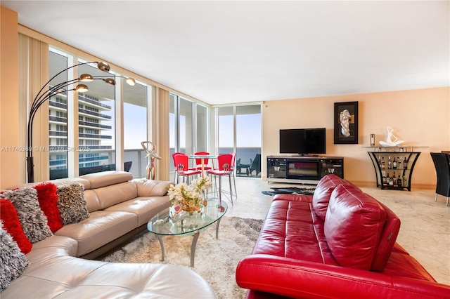 living room featuring floor to ceiling windows