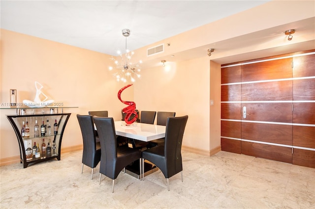 dining room featuring a chandelier