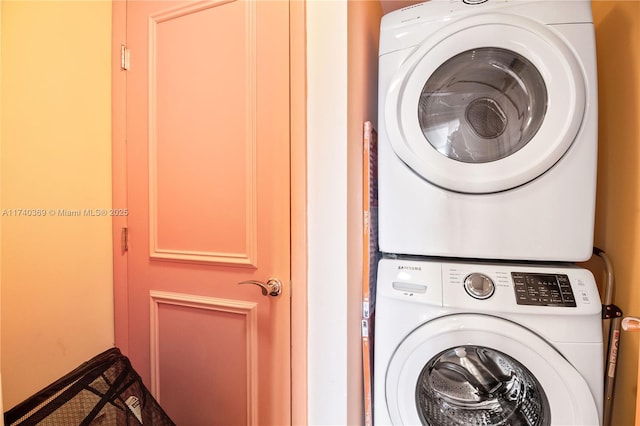 laundry area with stacked washer / dryer