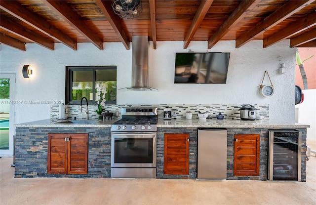 bar with wine cooler, wall chimney exhaust hood, sink, wooden ceiling, and appliances with stainless steel finishes