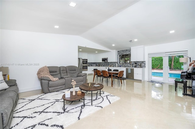 living room with vaulted ceiling