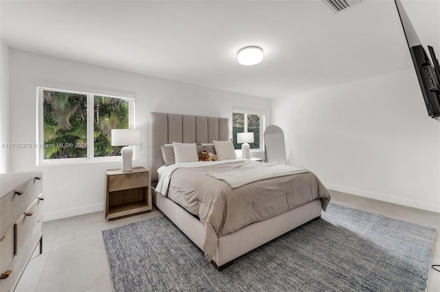 bedroom featuring light tile patterned floors