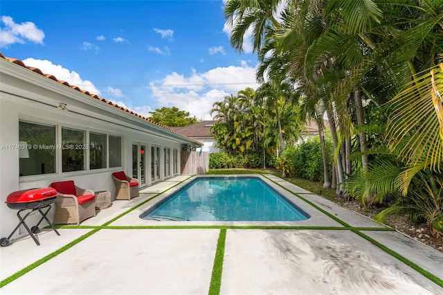 view of swimming pool with an outdoor living space and a patio area