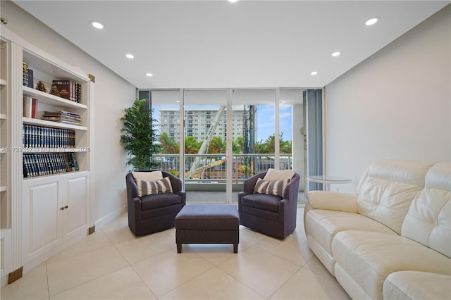 tiled living room featuring floor to ceiling windows and built in features