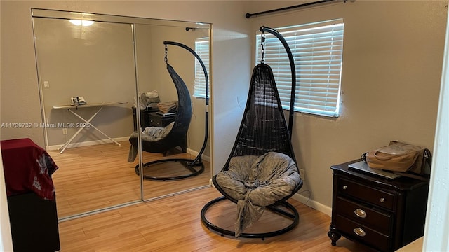 living area with light hardwood / wood-style flooring