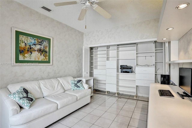 living area with light tile patterned floors, ceiling fan, visible vents, and recessed lighting