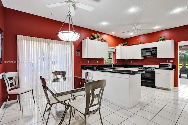 kitchen featuring ceiling fan, light tile patterned flooring, white cabinets, black appliances, and dark countertops