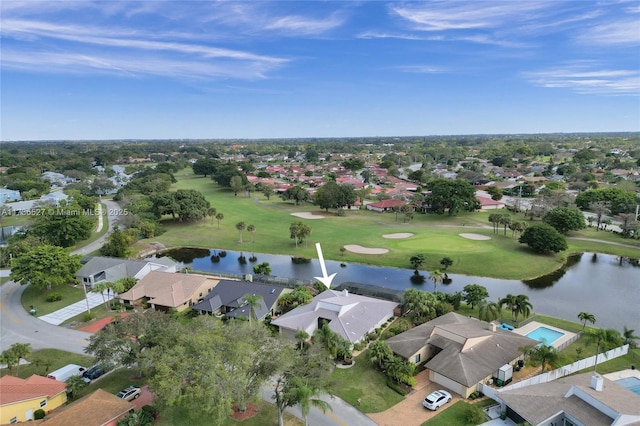 aerial view with view of golf course, a water view, and a residential view