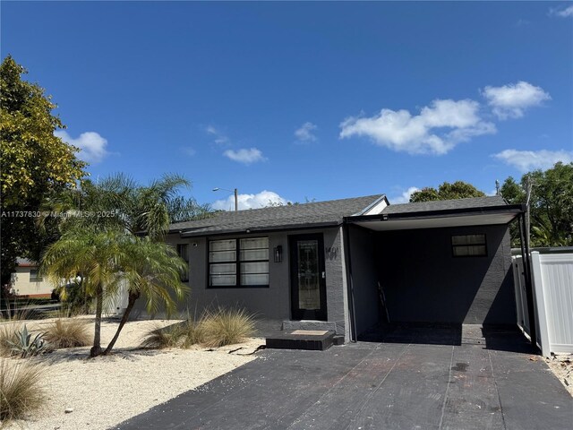 view of front of property with a carport