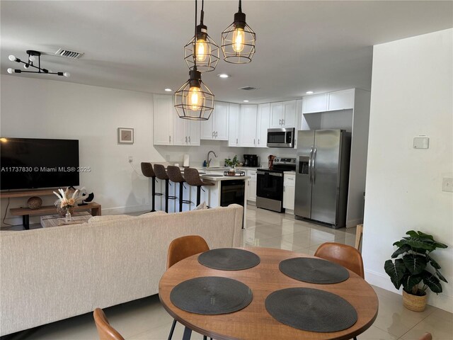 tiled dining space with sink