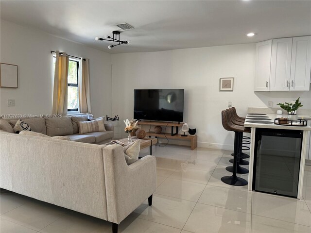 tiled living room featuring beverage cooler