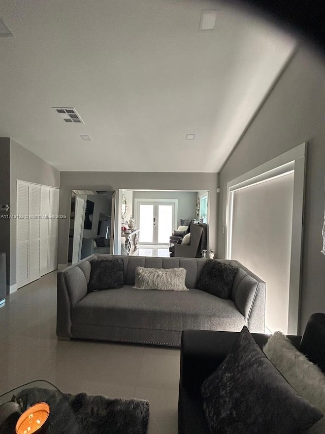 15281 SW 153rd St, Miami, FL 33187 - tiled living room featuring lofted ceiling, french doors, and visible vents