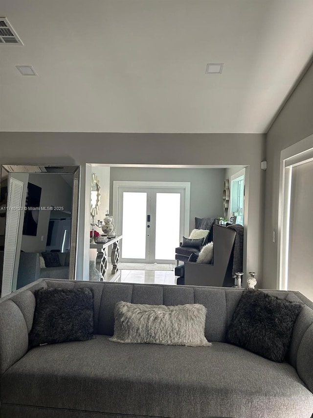 15281 SW 153rd St, Miami, FL 33187 - living area featuring lofted ceiling, french doors, and visible vents