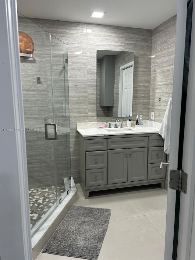 15281 SW 153rd St, Miami, FL 33187 - bathroom with a stall shower, vanity, tile walls, and tile patterned floors