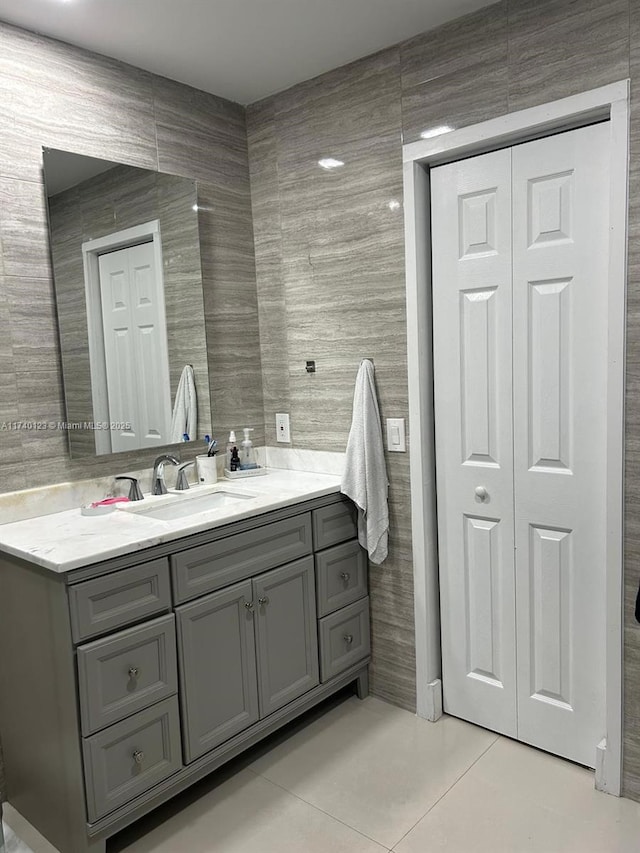 15281 SW 153rd St, Miami, FL 33187 - bathroom with a closet, vanity, tile walls, and tile patterned floors