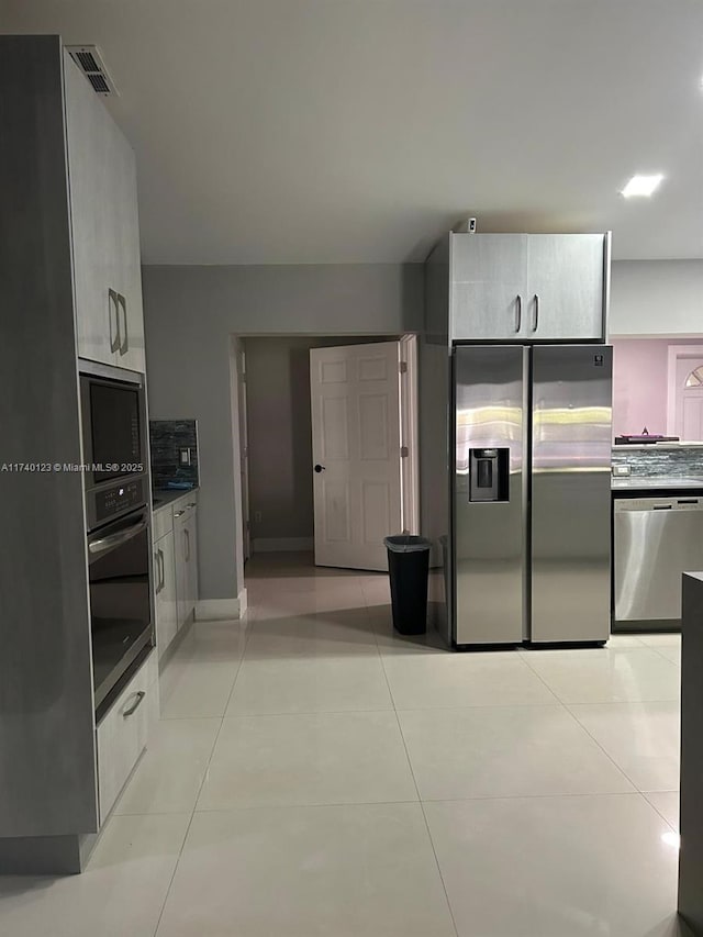 15281 SW 153rd St, Miami, FL 33187 - kitchen featuring stainless steel appliances, light tile patterned flooring, visible vents, and baseboards