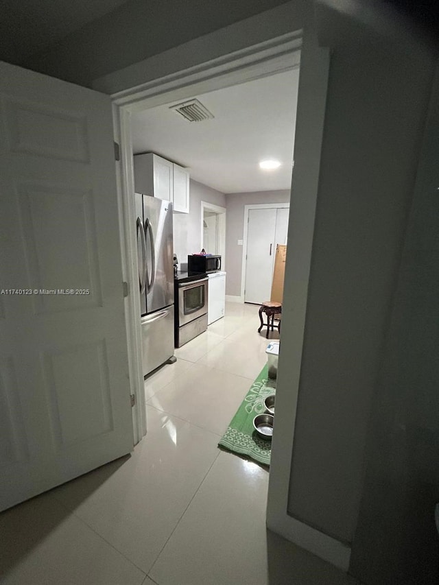 15281 SW 153rd St, Miami, FL 33187 - hall featuring light tile patterned flooring and visible vents