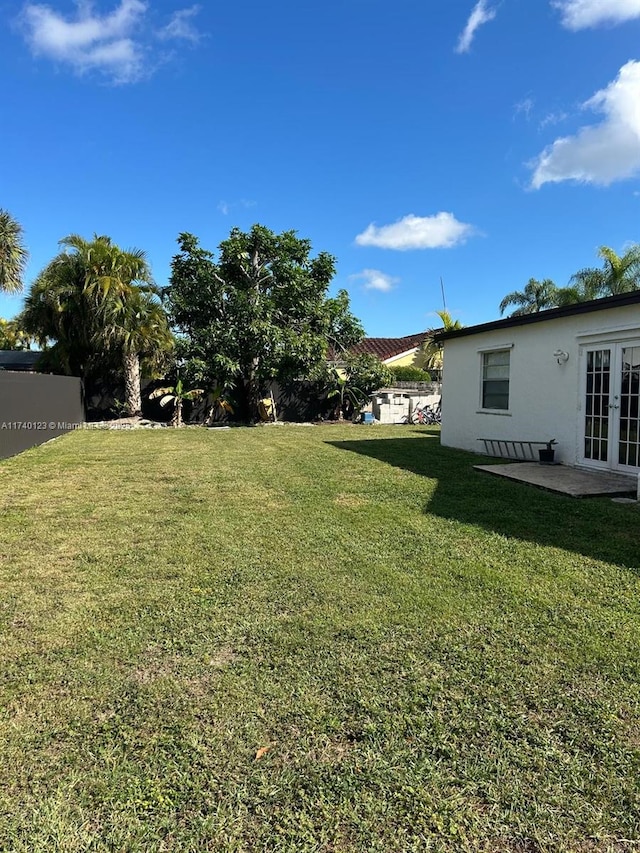 15281 SW 153rd St, Miami, FL 33187 - view of yard featuring french doors and fence