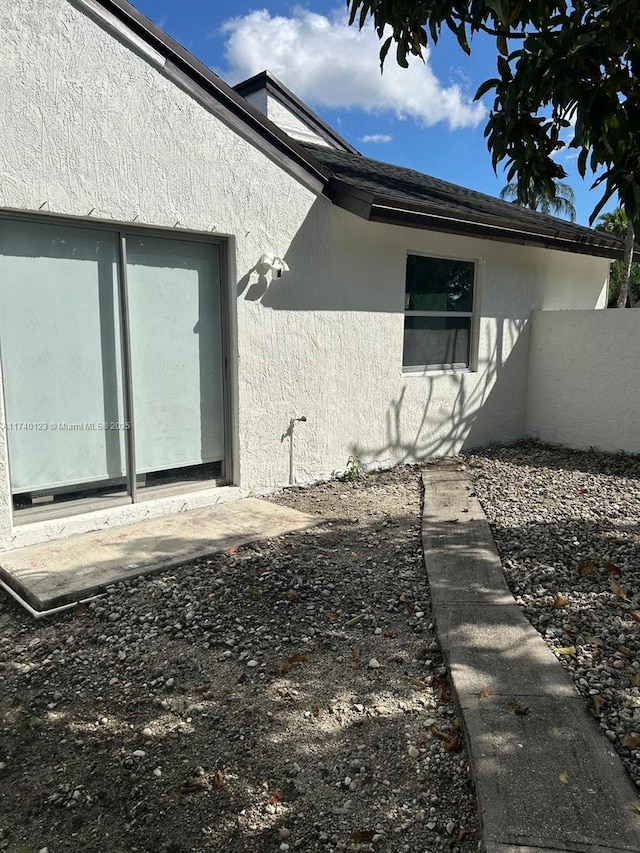 15281 SW 153rd St, Miami, FL 33187 - view of side of property with stucco siding