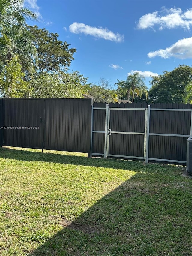 15281 SW 153rd St, Miami, FL 33187 - view of yard with fence and a gate