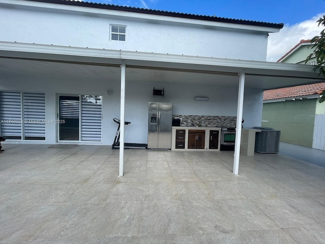 12676 NW 7th Ln, Miami, FL 33182 - back of property featuring central AC unit, stucco siding, and a patio
