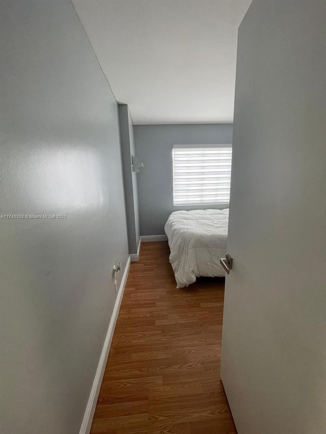 bedroom with hardwood / wood-style flooring