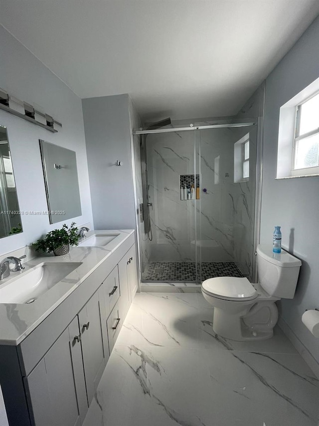 bathroom with vanity, toilet, and an enclosed shower