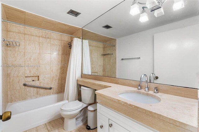 full bathroom featuring toilet, vanity, and shower / bathtub combination with curtain