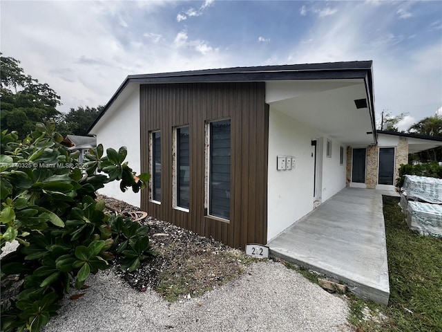 view of side of home featuring a patio