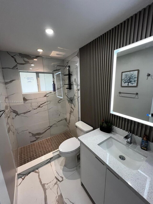 222 SW 8th St, Dania Beach, FL 33004 - bathroom with vanity, a tile shower, and toilet