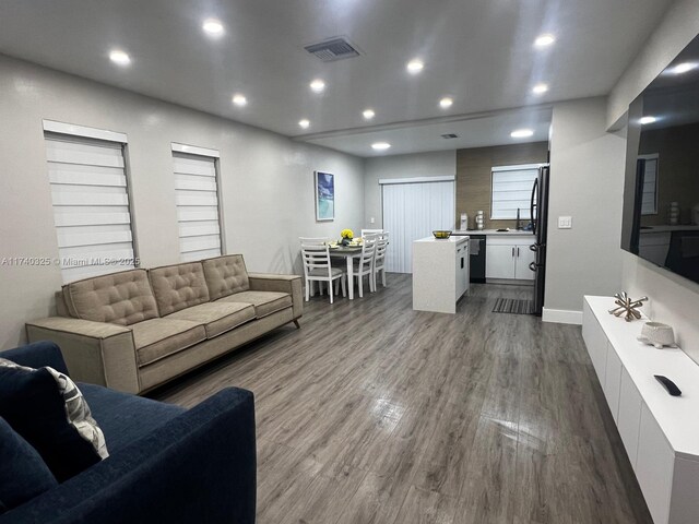 222 SW 8th St, Dania Beach, FL 33004 - living room featuring sink and hardwood / wood-style flooring