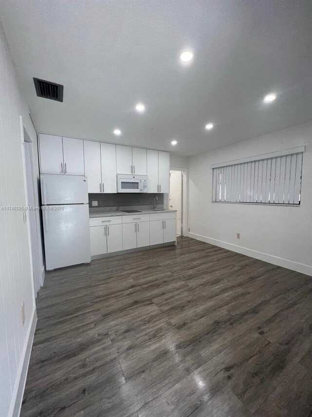 222 SW 8th St, Dania Beach, FL 33004 - kitchen featuring white cabinetry, white appliances, sink, and dark wood-type flooring