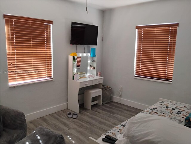 bedroom with hardwood / wood-style floors