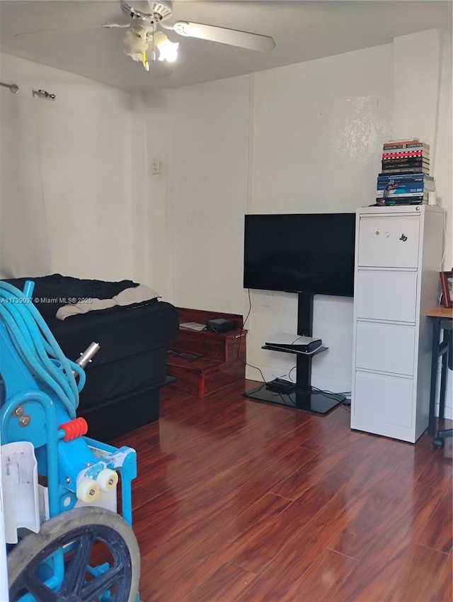 bedroom with dark wood-type flooring and ceiling fan