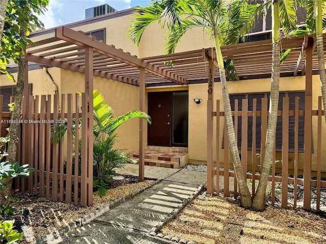 view of patio / terrace with a pergola and central air condition unit