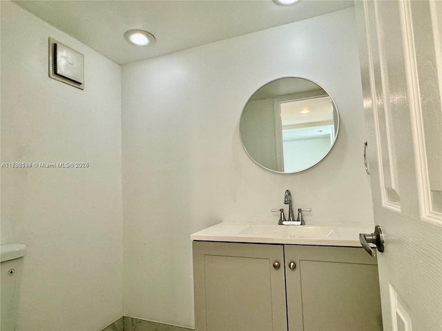 bathroom with vanity and toilet