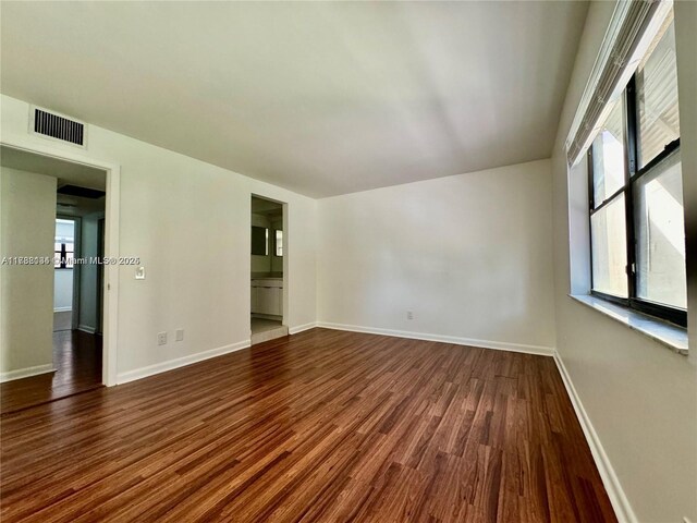 empty room featuring dark hardwood / wood-style floors