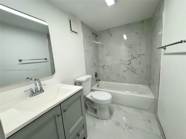 full bathroom featuring vanity, toilet, and tiled shower / bath