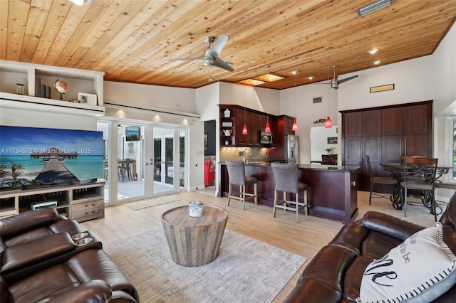 living room with light hardwood / wood-style flooring, wooden ceiling, ceiling fan, and french doors