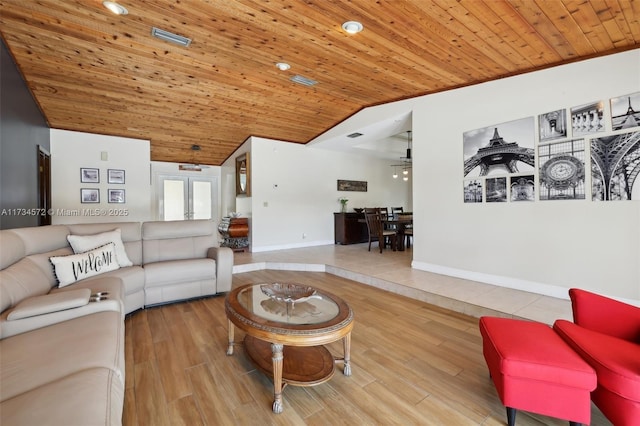 living room with lofted ceiling, light hardwood / wood-style flooring, and wooden ceiling