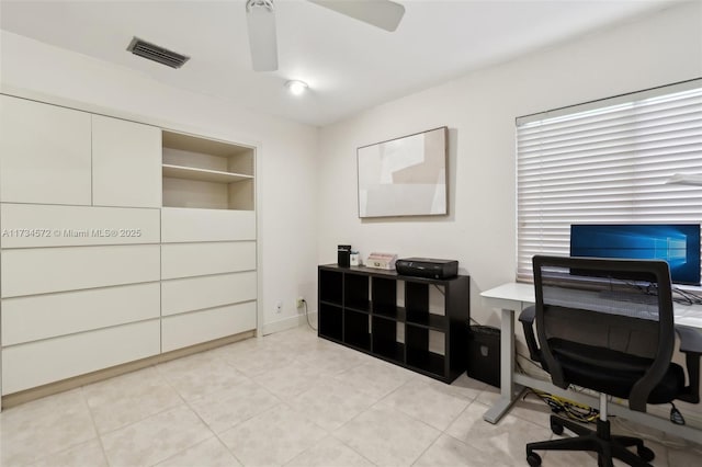 office space with light tile patterned flooring and ceiling fan