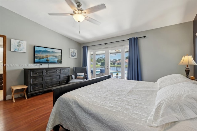 bedroom featuring french doors, lofted ceiling, dark hardwood / wood-style flooring, ceiling fan, and access to exterior