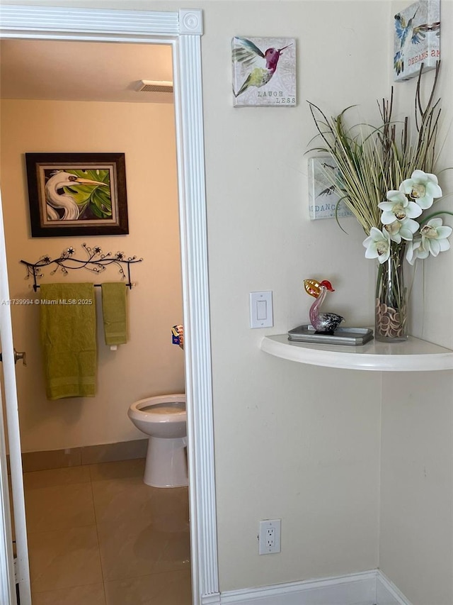 bathroom featuring tile patterned floors and toilet