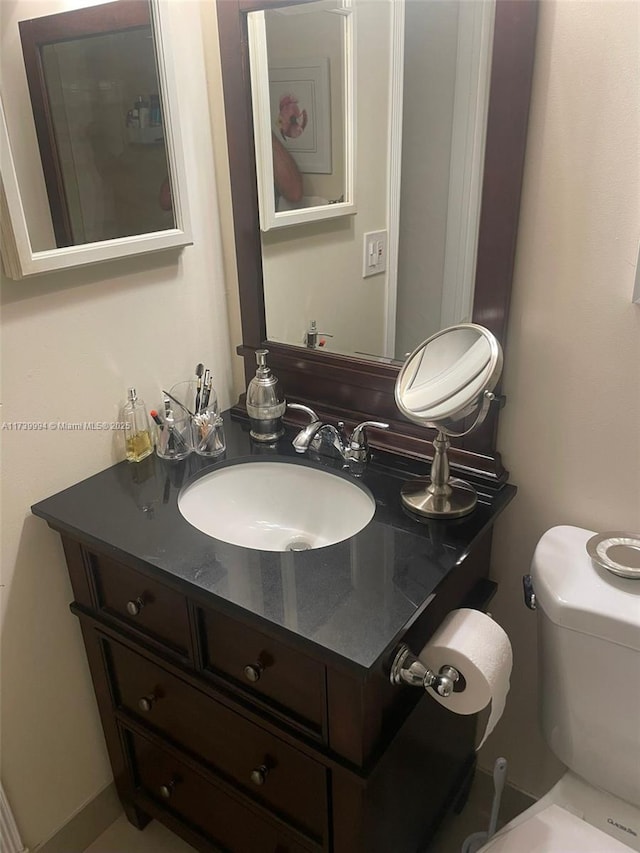 bathroom with vanity and toilet