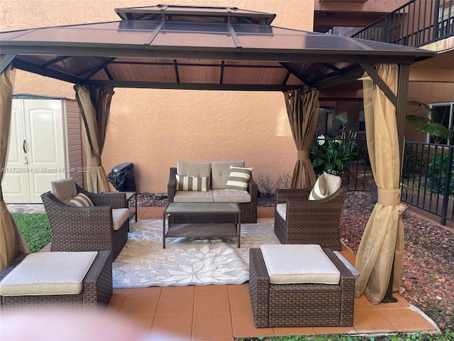 view of patio featuring a gazebo and an outdoor hangout area