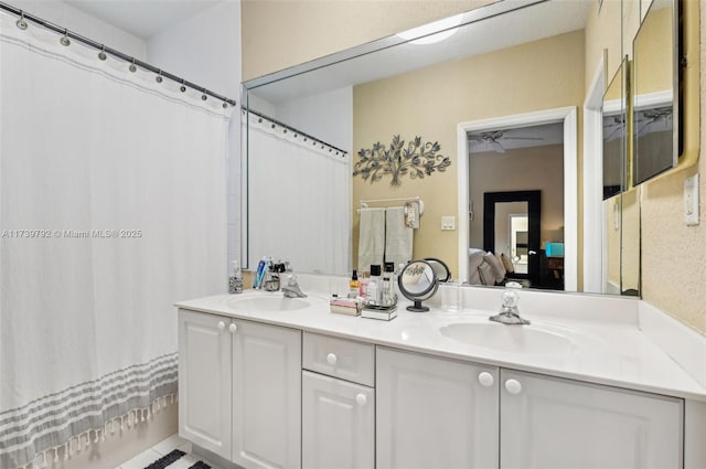 bathroom featuring vanity and shower / bath combo with shower curtain