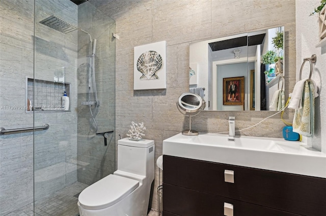 bathroom featuring tile walls, vanity, tasteful backsplash, an enclosed shower, and toilet