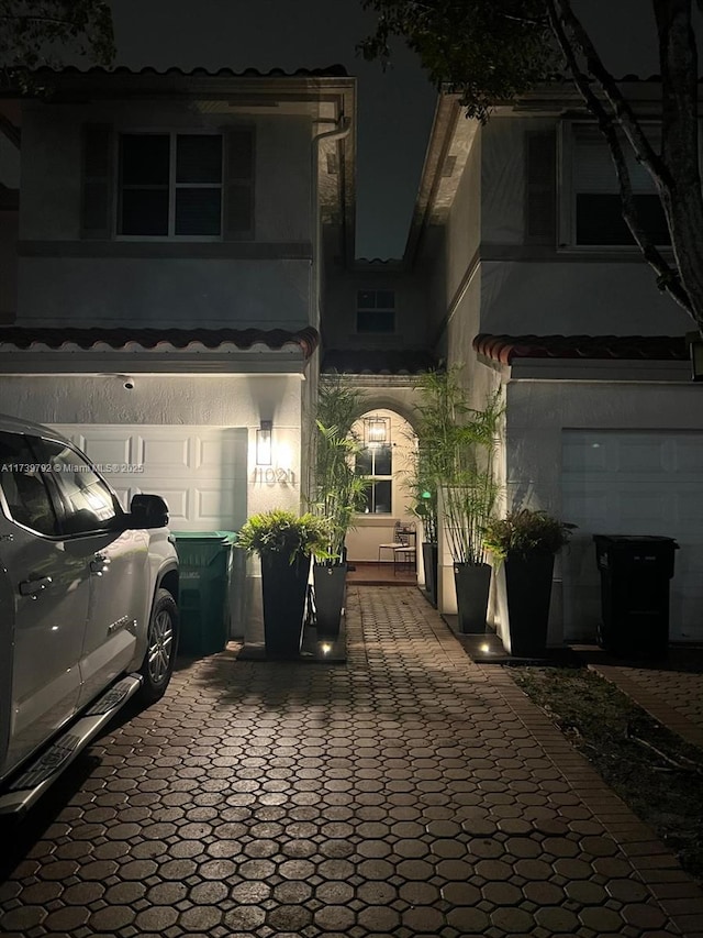 view of front of property with a garage