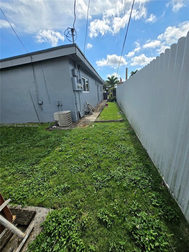 view of yard with central AC unit