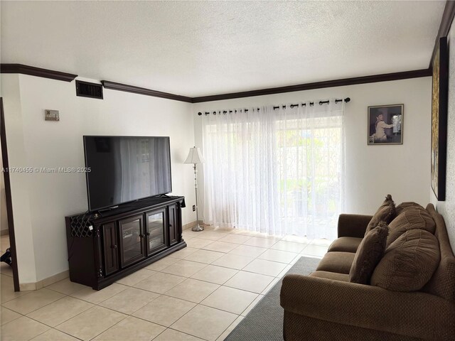 living room featuring crown molding, light tile patterned flooring, and a textured ceiling